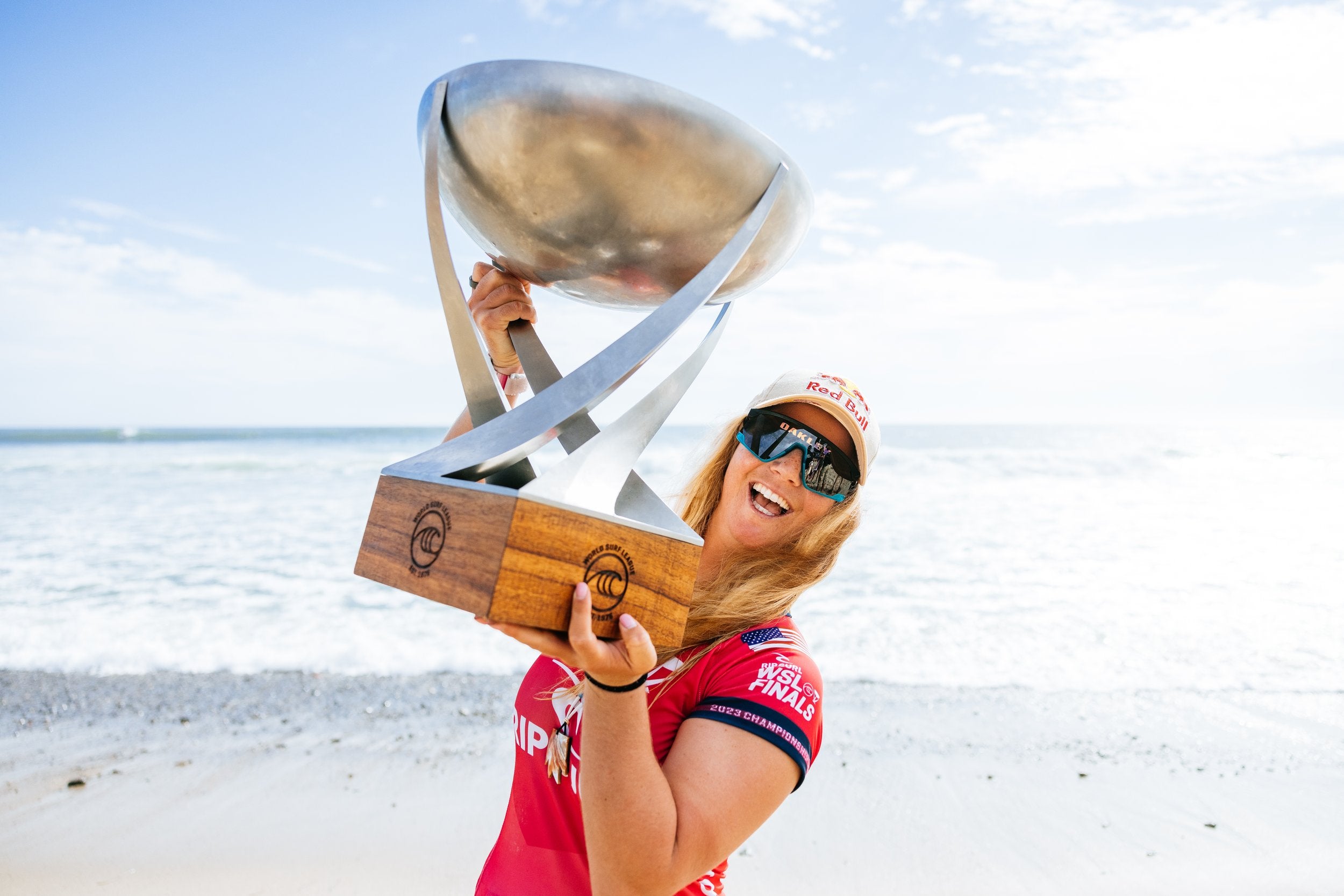 Caroline Marks holding her 2023 World Surf League Women's Championship Tour Trophy