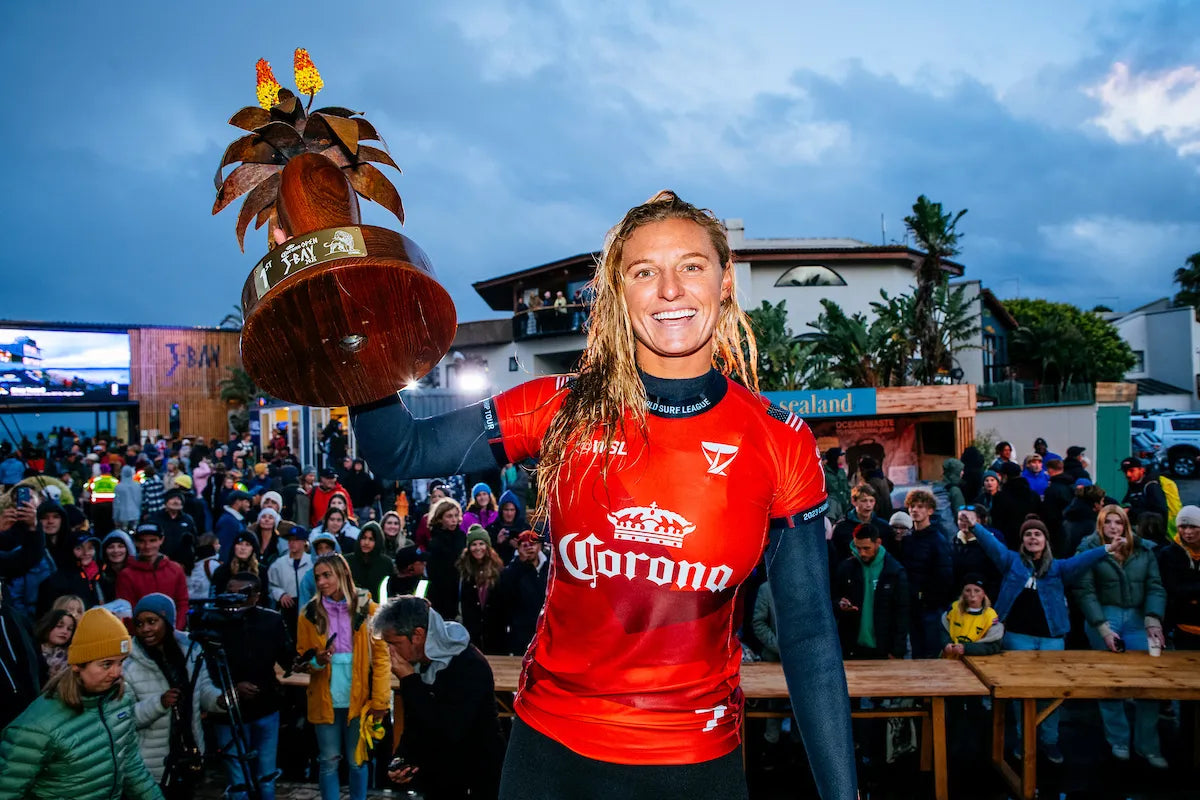 Lakey Peterson holding trophy from Corona Jbay Pro contest